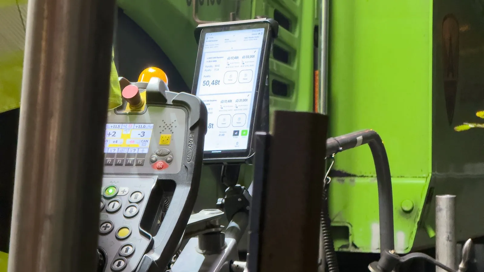 The app in use on a tablet mounted at the paver during night work