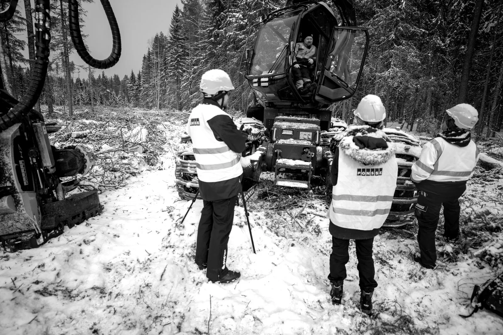 Field research: interviewing a harvester operator in his cabin on a winter site